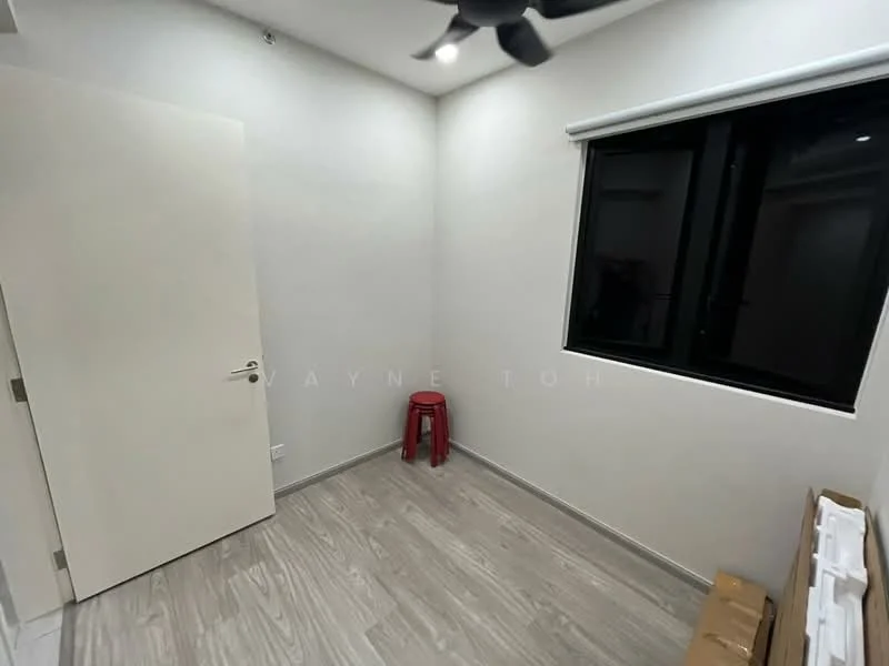 Room features: white painted walls, laminate flooring, black framed window, ceiling fan, door, red stool, baseboard, window treatment.