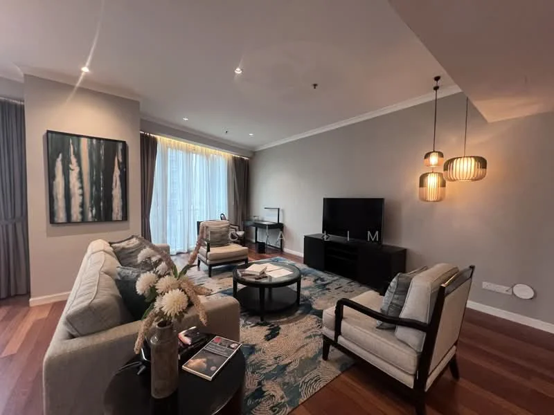 Living features: 3-seater fabric sofa in light grey, 2 armchairs with light upholstery, coffee table with glass top, area rug with floral pattern, wall-mounted TV, TV console in dark wood, pendant lighting with multiple bulbs, framed artwork with forest theme, floor-to-ceiling windows with sheer curtains, wooden flooring, recessed downlights, decorative vase with flowers; style: modern; view: city.
