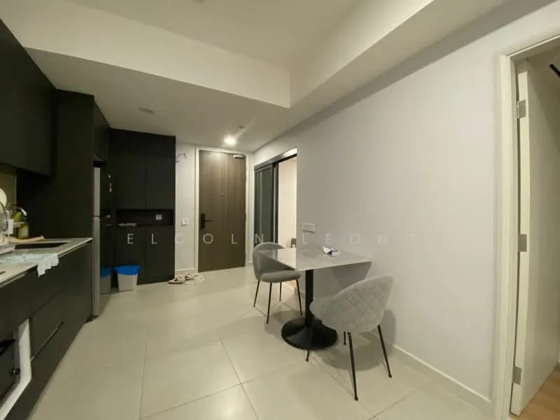 Room features: black cabinetry, white countertop, stainless-steel sink, built-in refrigerator, ceramic tile flooring, recessed lighting, dining table for two, grey upholstered chairs, open layout, doorway leading to another room, trash bin, wall-mounted light switch; style: modern.