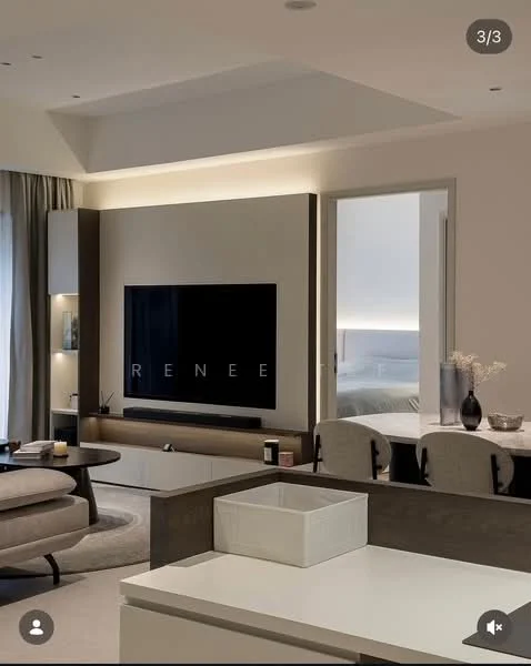 Living features: wall-mounted TV, light wood cabinetry, neutral wall colour, recessed lighting, sofa with cushions, coffee table, decorative vase, area rug, curtains, open layout to adjacent room; style: modern.