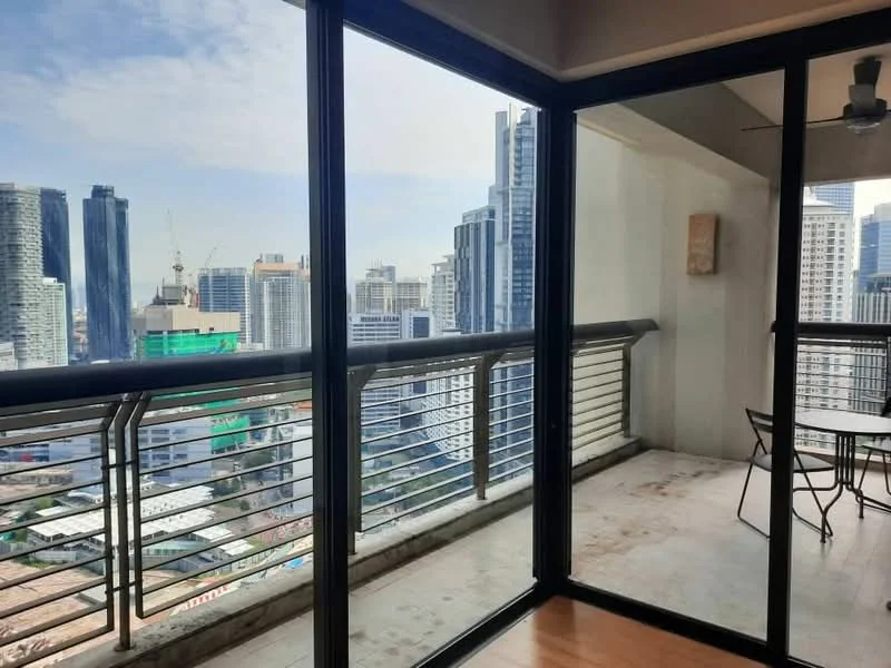 Room features: floor-to-ceiling windows, glass sliding door, metal railing, concrete flooring, city skyline view, outdoor balcony space, ceiling fan; style: modern; view: city.