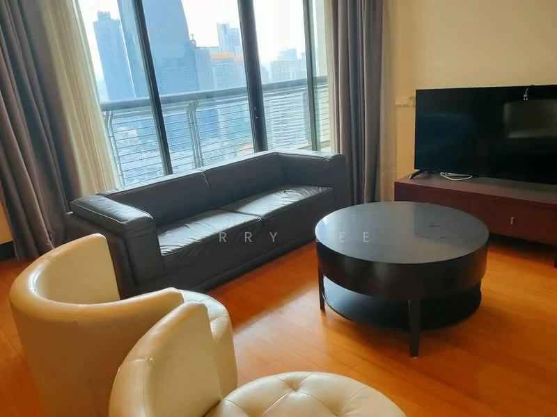 Living features: 3-seater leather sofa in black, round coffee table with black surface, floor-to-ceiling windows, curtains in grey, wooden flooring, wall-mounted TV, TV console in dark wood, city skyline view; style: modern; view: city.