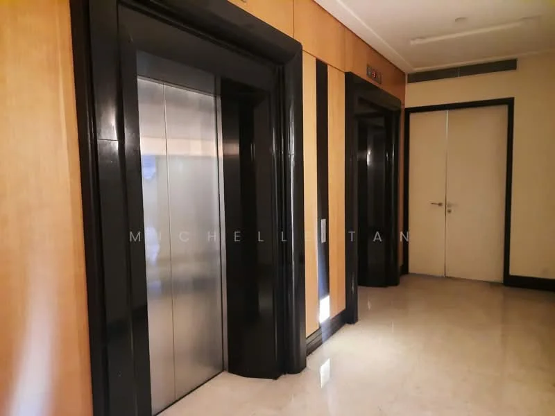 Room features: elevator doors, wood paneling on walls, marble flooring, lighting fixtures, neutral wall color, black trim around elevator, door to adjacent room; style: modern.