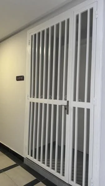 Room features: white security grille door, grey tiled flooring, white painted walls, black and white patterned border tiles, door handle, number plate with 'A-20', interior lighting; style: modern.