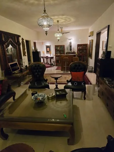 Living features: cream painted walls, marble tile flooring, chandelier with decorative design, 5-blade ceiling fan, wooden coffee table, upholstered armchairs in dark brown, sofa with red and black upholstery, decorative wall art, wooden display cabinets, area rug with intricate pattern, ornamental ceiling lights, wooden side tables; style: traditional.