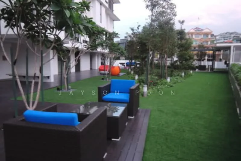 Exterior type: landscape garden; features: manicured lawn, outdoor seating area with rattan furniture, blue cushions on chairs, paved walkway, decorative trees, surrounding residential buildings, greenery, open space; style: modern.