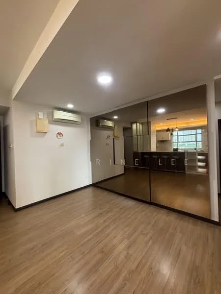 Room features: laminate flooring, white painted walls, recessed downlights, mirror wall, wall-mounted split AC, open layout, kitchen area visible in background, large window for natural light; style: modern.