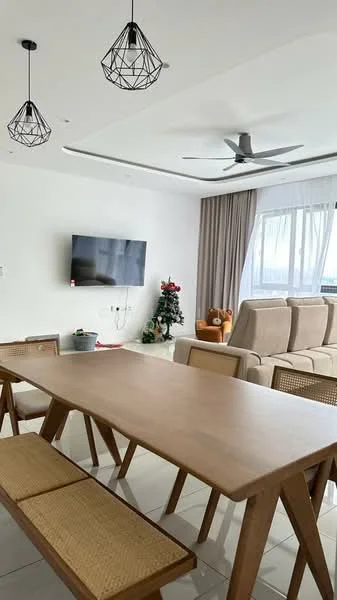 Living features: white painted walls, glossy tile flooring, 5-blade ceiling fan with light, two pendant lights, wall-mounted TV, large windows with sheer curtains, sofa with beige upholstery, wooden dining table, bench seating, decorative Christmas tree, decorative items on the table; style: modern; view: city.