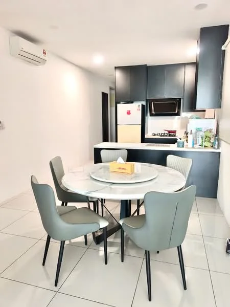 Dining features: round dining table with marble top, 4 upholstered dining chairs in light grey, white walls, tile flooring, wall-mounted split AC, kitchen area visible in background, built-in kitchen cabinetry in dark colour, stainless-steel fridge, freestanding range oven, kitchen countertop, sink visible in kitchen area; style: modern.