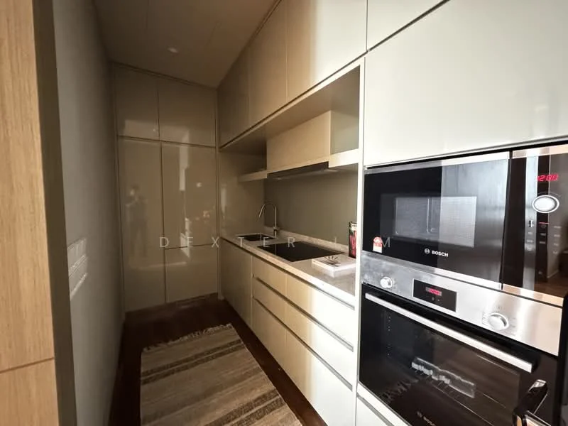 Kitchen features: white high-gloss cabinetry, black countertop, built-in oven, built-in microwave, single-bowl stainless-steel sink, chrome pull-down faucet, recessed downlights, wood flooring, area rug with geometric pattern; style: modern.