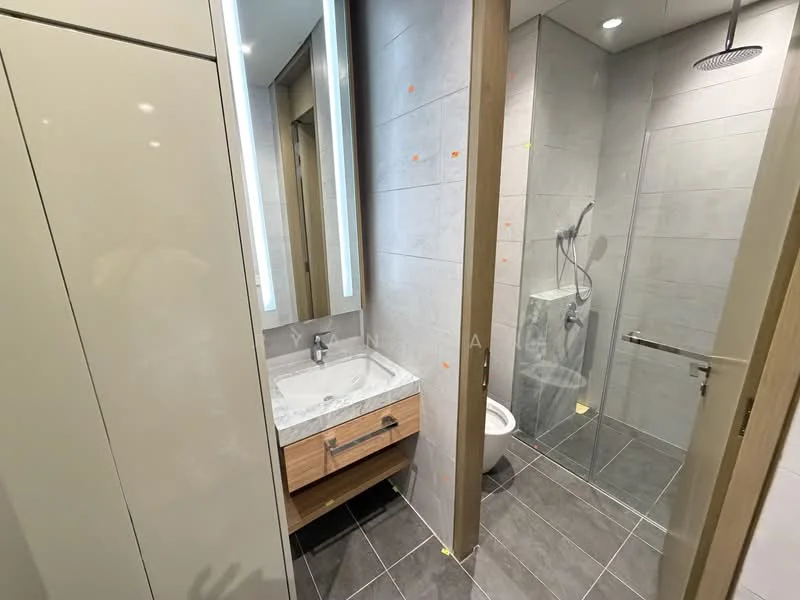 Bathroom features: single-sink vanity with wood cabinet, marble countertop, framed mirror, walk-in shower with glass enclosure, rain shower head, handheld shower, one-piece toilet, grey tile flooring, tile cladding on walls, recessed downlights; style: modern.