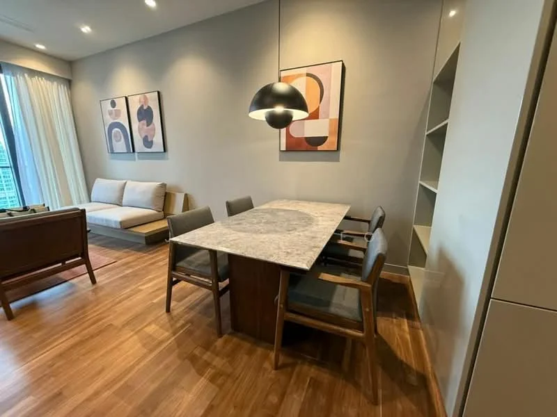 Dining features: marble dining table, 4 dining chairs, wooden dining table base, framed artwork on walls, sofa in background, wooden flooring, recessed ceiling lights, floor-to-ceiling windows with sheer curtains; style: modern; view: city.