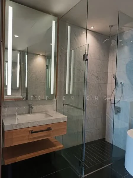 Bathroom features: single-sink vanity with wood cabinet, marble countertop, framed mirror, walk-in shower with glass enclosure, rain shower head, handheld shower, tile cladding on walls, black tile flooring, recessed downlights, chrome basin mixer, freestanding bathtub, glass partition; style: modern.
