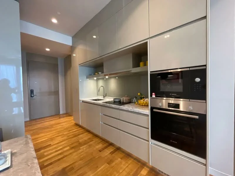 Kitchen features: light grey high-gloss cabinetry, marble countertop, built-in oven, built-in microwave, stainless-steel sink, chrome pull-down faucet, recessed downlights, wooden flooring, open shelving, decorative items on shelves, yellow decorative bowls; style: modern.