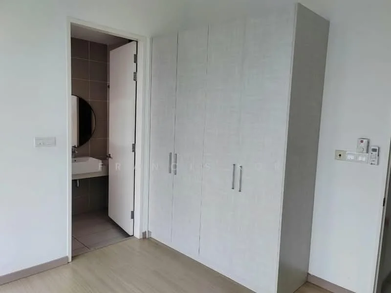 Room features: built-in wardrobe with light wood finish, white painted walls, laminate flooring, round mirror, door leading to bathroom, light switch panel, electrical outlets; style: modern.