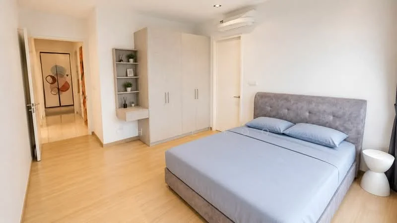 Bedroom features: queen-size bed with grey upholstered headboard, light blue bedding, laminate flooring, white painted walls, built-in wardrobe with light wood finish, wall-mounted shelf with decorative plants, 1 bedside table in white, 1 wall-mounted split AC; style: modern. Room features: doorway leading to hallway, light-colored walls, laminate flooring.