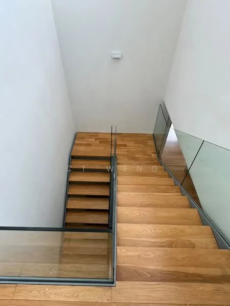 Room features: wooden staircase, glass railing, white painted walls, natural light from upper level, smooth wooden steps, minimalist design, open space, modern aesthetic; style: modern.