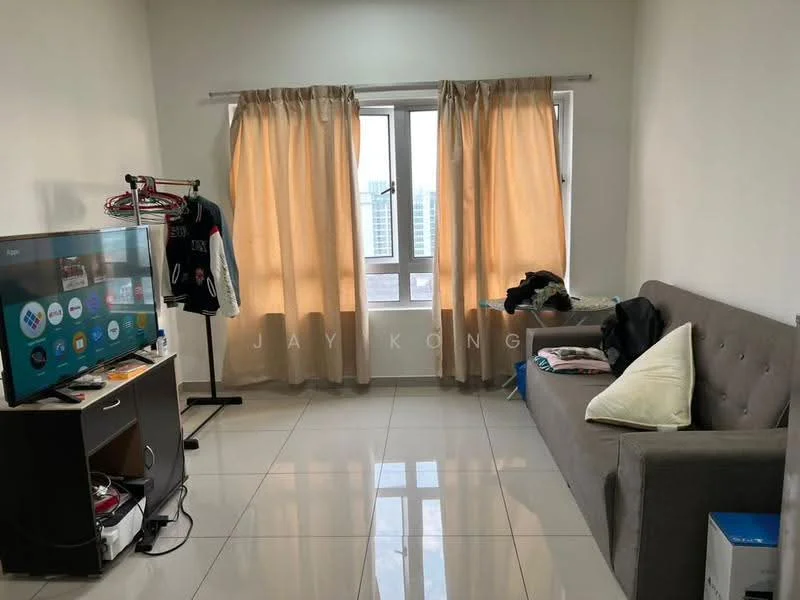 Living features: grey fabric sofa, flat-screen TV on stand, white walls, cream curtains, tile flooring, window with city view, decorative throw pillows, clothes rack, small side table, stack of items on side table; style: modern; view: city.