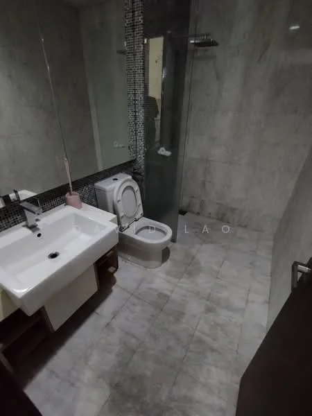 Bathroom features: single-sink vanity with wood cabinet, white ceramic sink, chrome basin mixer faucet, one-piece toilet, walk-in shower with glass enclosure, rain shower head, grey marble tile flooring, grey marble wall cladding, mirror above sink, shelf for toiletries; style: modern.