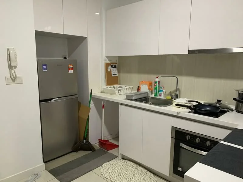 Kitchen features: white glossy cabinetry, stainless-steel fridge, single-bowl stainless-steel sink, chrome pull-down faucet, black cooktop with oven, grey countertop, tile backsplash, kitchen utensils on countertop, mop and broom visible, floor mat, wall-mounted phone, open shelving, cleaning supplies visible; style: modern.