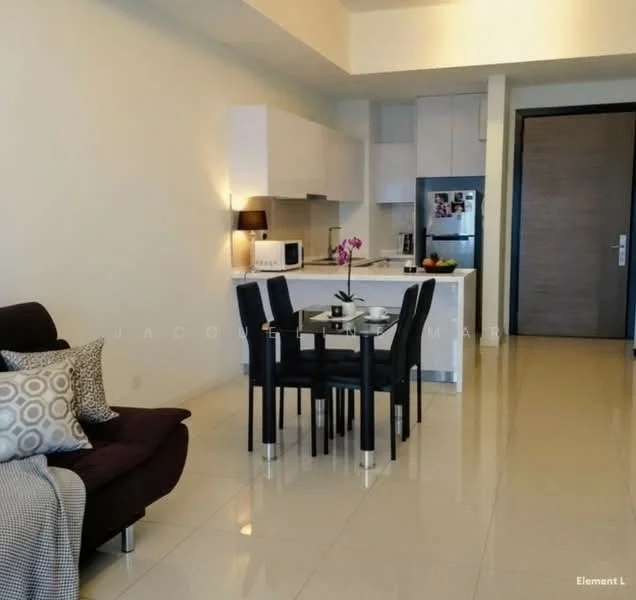 Living features: cream painted walls, glossy tile flooring, sofa with decorative cushions, black dining table with four chairs, refrigerator, microwave, built-in kitchen cabinets, countertop, table lamp, decorative plant, fruit bowl; style: modern.