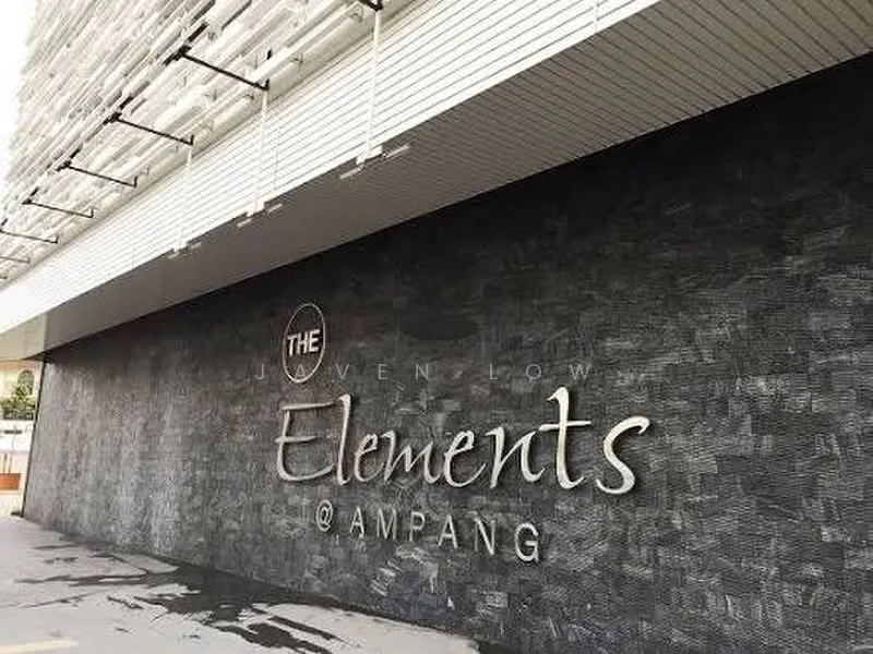 Exterior type: high-rise condominium; features: textured stone facade, large overhang, modern architectural design, prominent signage, outdoor parking area, glass curtain wall, horizontal louvre screens; style: modern.
