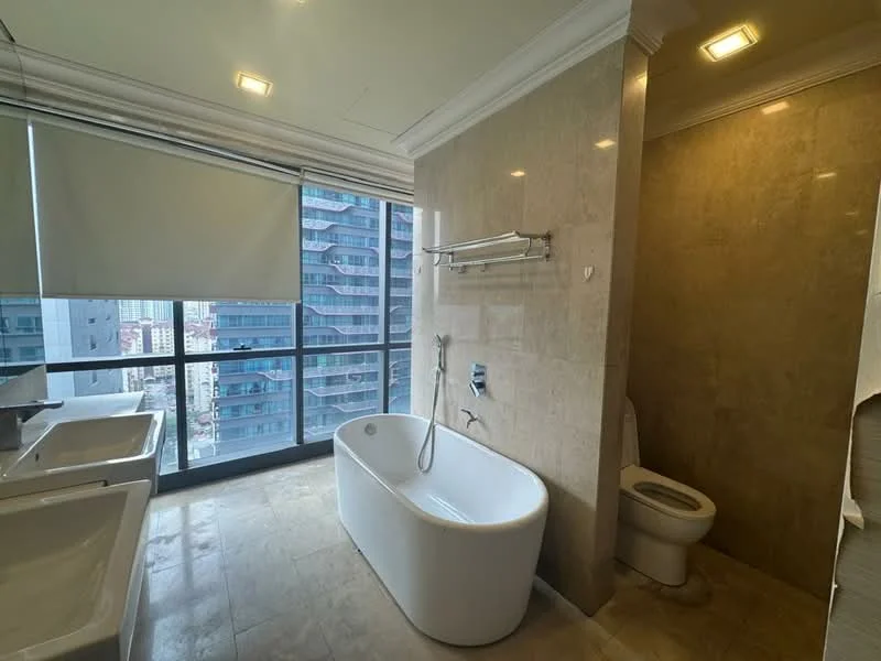 Bathroom features: freestanding bathtub, single-sink vanity with white cabinet, chrome basin mixer faucet, toilet, glass shower enclosure, tile cladding on walls, marble tile flooring, recessed downlights, floor-to-ceiling windows, roller blinds; style: modern; view: city.