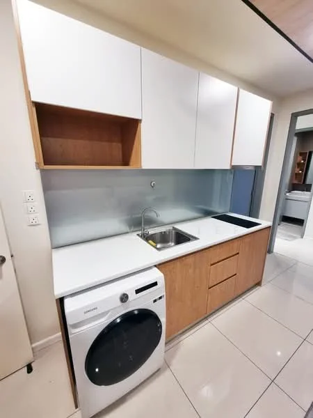 Kitchen features: white upper cabinets, wood lower cabinets, stainless-steel sink, single-bowl stainless-steel sink, chrome faucet, white countertop, built-in washing machine, tile flooring, backsplash with metallic finish, open shelving, recessed lighting; style: modern.