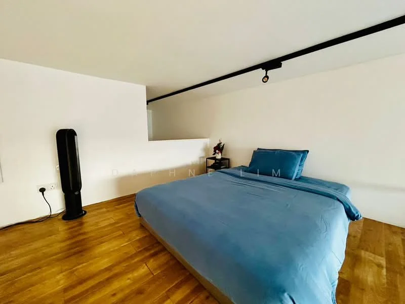 Bedroom features: king-size bed with blue bedding, wooden flooring, white painted walls, track lighting, floor fan, minimalist decor; style: modern.