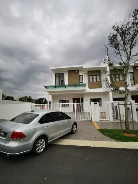 Exterior type: linked terrace house; features: two-storey building, white painted facade, brown accent panels, flat roof with overhang, front porch with paving stones, fenced front yard, single car driveway, landscaped area with small tree, windows with black frames, main entrance door with glass panels; style: modern.