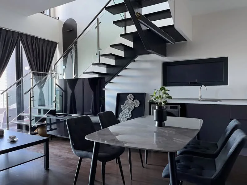 Living features: glass railing staircase, dark wood flooring, black TV console, wall-mounted TV, grey marble dining table, black upholstered dining chairs, black cabinetry, decorative artwork, potted plant, floor-to-ceiling windows with sheer curtains; style: modern; view: city.