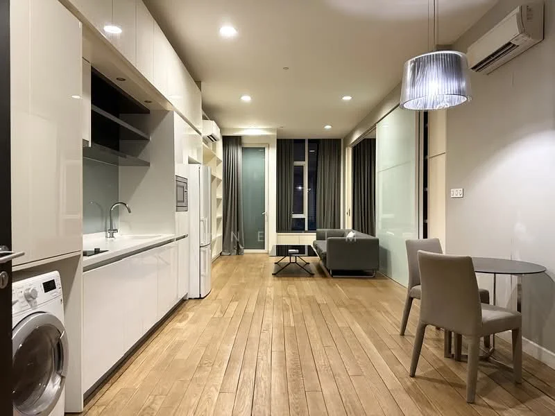 Living features: light wood flooring, white cabinetry, stainless-steel refrigerator, built-in oven, microwave, single-bowl stainless-steel sink, chrome pull-down faucet, washing machine, round dining table, upholstered dining chairs, sofa in grey fabric, floor-to-ceiling windows with sheer curtains, recessed LED downlights, pendant light, air conditioning unit; style: modern.