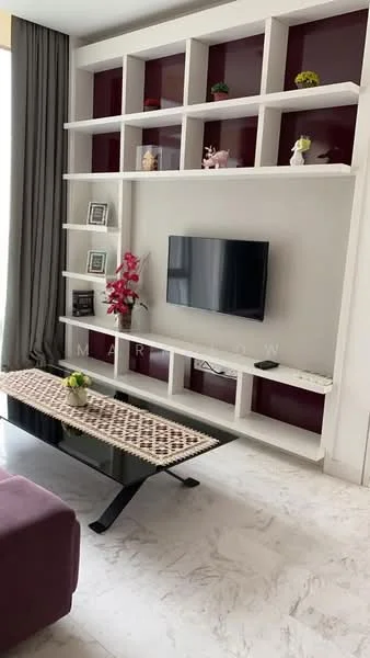 Living features: white painted walls, marble flooring, built-in shelving unit with red accent, wall-mounted TV, decorative plants on shelves, coffee table with unique design, curtains, sofa in purple fabric; style: modern.