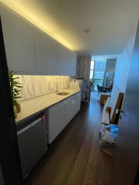 Kitchen features: white cabinetry, marble backsplash, single-bowl stainless-steel sink, chrome pull-down faucet, under-cabinet lighting, wooden flooring, built-in refrigerator, counter space, open layout, window view, decorative plant; style: modern; view: city.
