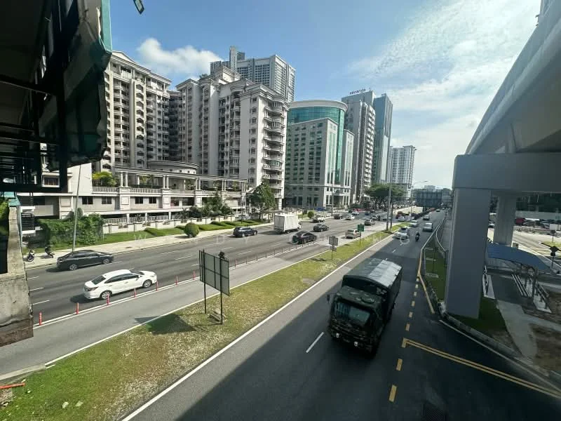 Exterior type: high-rise condominium; features: glass curtain wall, white painted facade, recessed balconies, surrounded by mature greenery, urban context with main road, multiple high-rise buildings, visible traffic on road; style: modern.