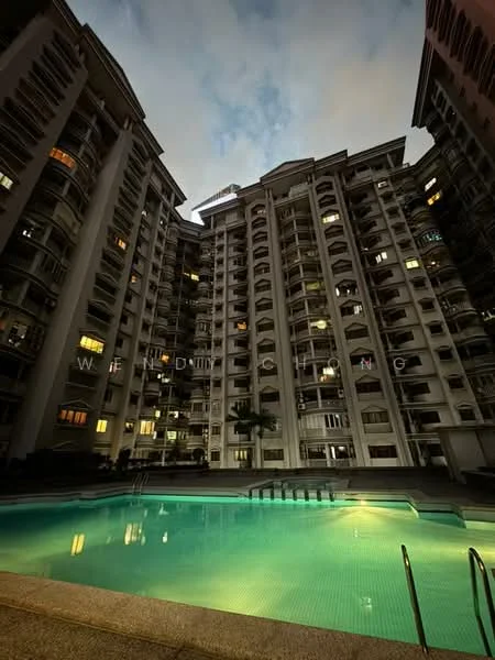 Exterior type: high-rise condominium; features: swimming pool, pool deck, multiple balconies, glass curtain wall, illuminated facade, landscaped garden area, surrounding residential buildings, night lighting, paved walkway, palm trees; style: modern.