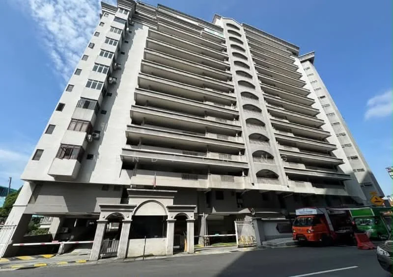 Exterior type: mid-rise condominium; features: white painted facade, balconies with arches, multiple floors, ground-level parking area, entrance with archway, visible air conditioning units, street view, surrounded by road; style: modern.