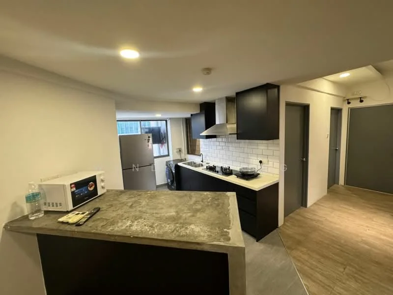 Kitchen features: grey concrete countertop, black cabinetry, white subway tile backsplash, stainless-steel range hood, 4-burner gas hob, built-in oven, stainless-steel fridge, microwave, double-bowl stainless-steel sink, chrome pull-down faucet, washing machine, pendant lighting, recessed downlights; style: modern. Room features: wood-look vinyl flooring, white painted walls, doorway leading to hallway.