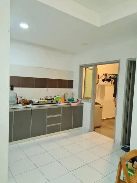 Kitchen features: grey cabinetry with flat-panel doors, white tiled backsplash, white countertop, single-bowl stainless-steel sink, chrome pull-down faucet, built-in oven, freestanding washing machine, ceramic tile flooring, recessed downlights, open shelving, kitchen utensils and appliances visible, clothes drying rack in doorway, doorway leading to laundry area; style: modern.