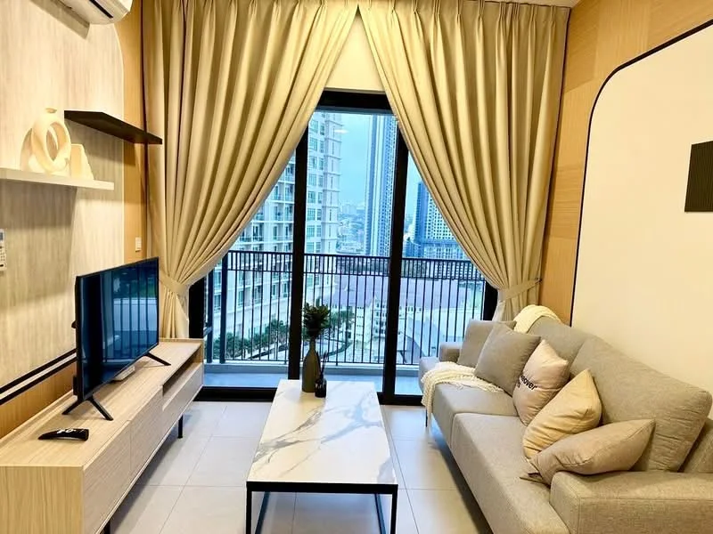 Living features: grey fabric 3-seater sofa, marble coffee table, wall-mounted TV, light wood TV console, floor-to-ceiling windows, sheer curtains, blackout curtains, decorative wall paneling, air conditioning unit, decorative vase on table, area rug; style: modern; view: city.