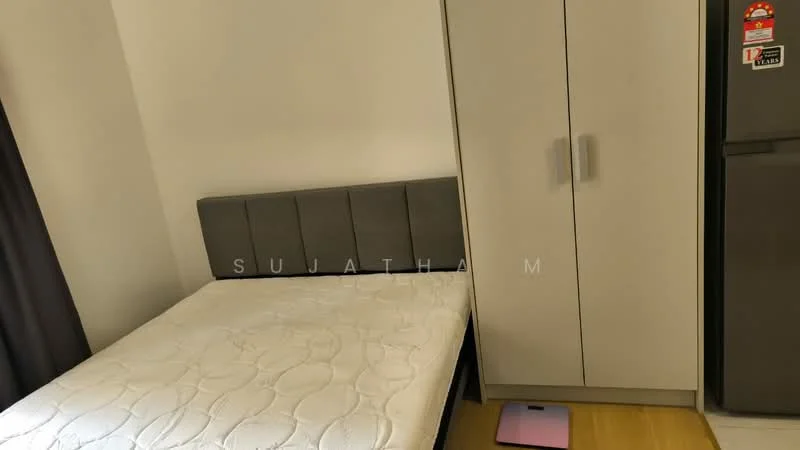 Bedroom features: queen-size bed, upholstered headboard, built-in wardrobe with grey doors, wooden flooring, blackout curtains, light-colored walls, floor space with a pink mat, refrigerator, minimalist decor; style: modern.