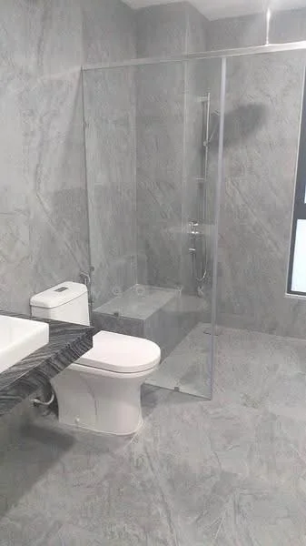Bathroom features: walk-in shower with glass enclosure, rain shower head, handheld shower, white one-piece toilet, single-sink vanity with dark stone countertop, grey marble tile flooring, grey marble wall tiles, large window for natural light; style: modern.