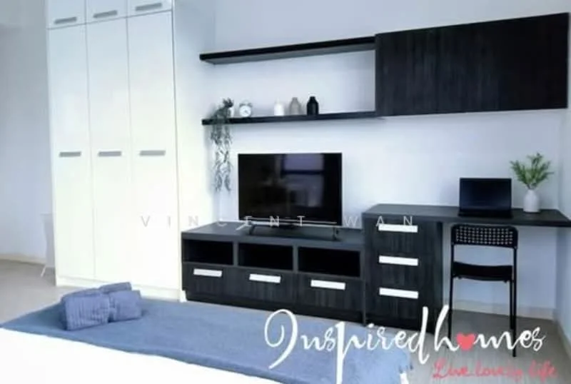 Room features: light wood flooring, white painted walls, black TV console, wall-mounted TV, black shelving unit, white wardrobe with sliding doors, black desk with chair, decorative items on shelves, bed with blue bedding; style: modern.