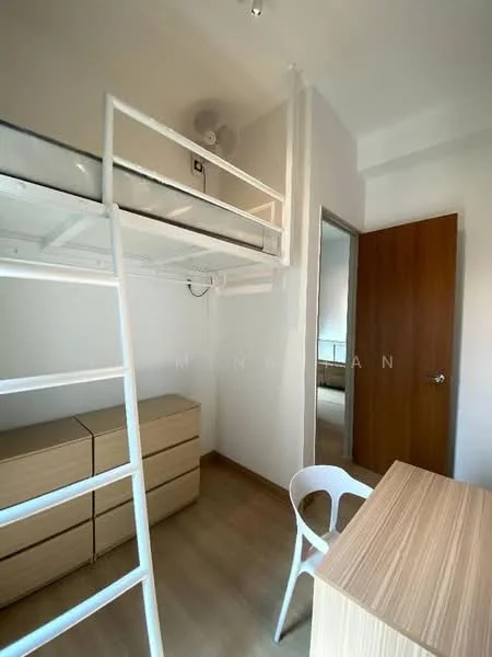 Room features: lofted bed with white metal frame, wooden dresser with multiple drawers, wooden study desk, white plastic chair, light wood flooring, white painted walls, ceiling fan, door with wooden finish; style: modern.
