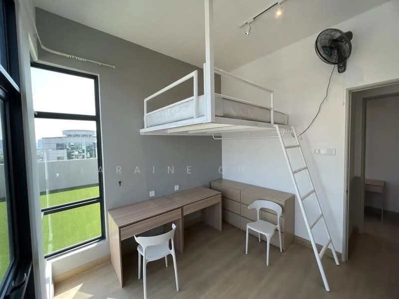 Bedroom features: lofted bed with white frame, desk with wooden surface, white chair, built-in wooden dresser, large window with black frame, green view outside, light wood flooring, wall-mounted fan, grey accent wall, white walls, recessed ceiling lights; style: modern; view: garden.