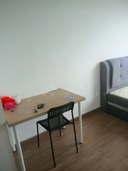 Room features: white painted walls, laminate flooring, grey upholstered bed, wooden bed frame, simple desk, black chair, scattered items on desk; style: minimalist.