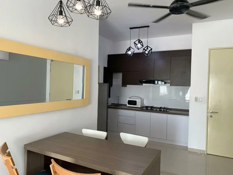 Dining features: rectangular wooden dining table, 4 dining chairs, mirror with yellow frame, pendant lighting with geometric design, ceiling fan with 3 blades, white walls, glossy tile flooring, kitchenette visible in background, stainless-steel fridge, built-in kitchen cabinets, gas stove with 4 burners, microwave; style: modern.