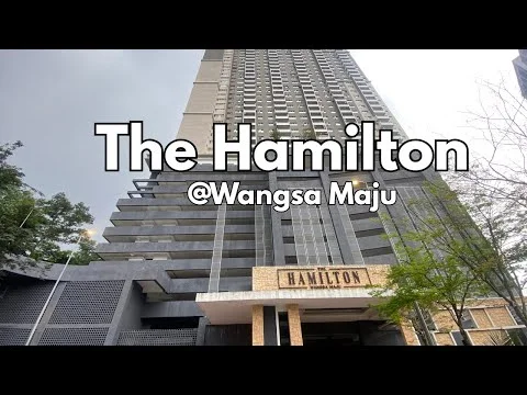 Exterior type: high-rise condominium; features: glass curtain wall, exposed concrete facade, projecting balconies, feature lighting at night, double-volume main lobby, manicured landscaping, surrounded by mature greenery; style: modern.