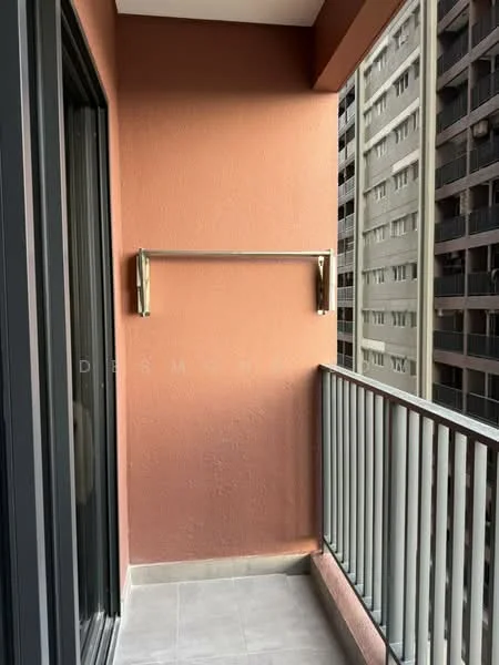 Room features: orange painted walls, grey tiled flooring, metal railing, clothes drying rack, sliding glass door; style: modern; view: city.