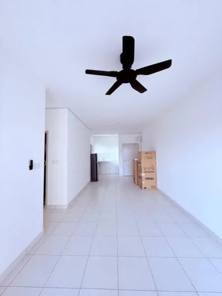 Room features: white painted walls, tile flooring, 5-blade ceiling fan, open layout, kitchen area visible in background, boxes stacked against wall, doorway leading to another room; style: modern.